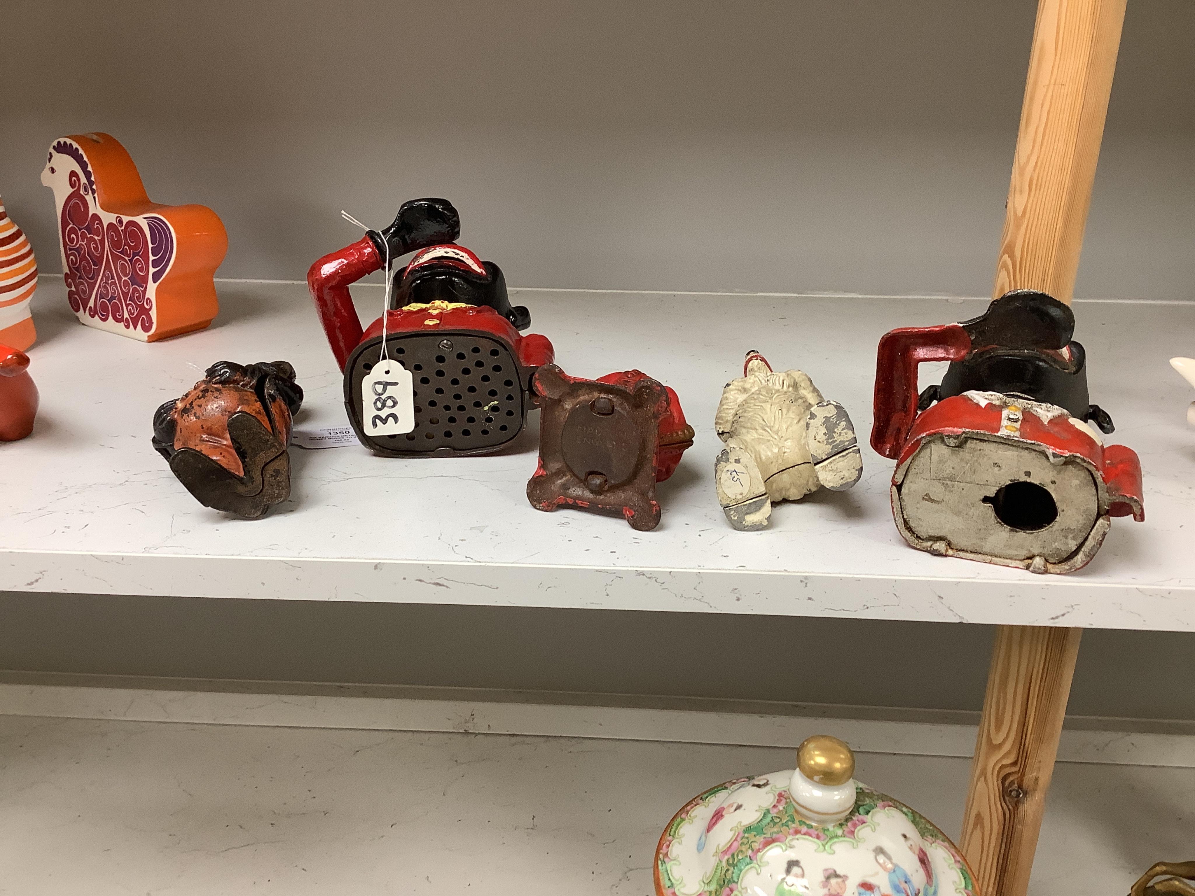 Six various metalware money boxes to include to jolly money banks, standing bear and one in the form of a crown. Condition - fair with general wear